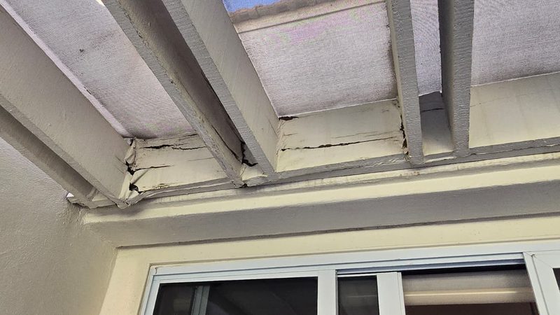 Water damaged patio cover beam Palm Desert before repair