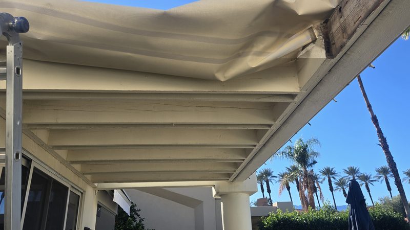 Damaged patio cover from underneath sagging canvas Palm Desert