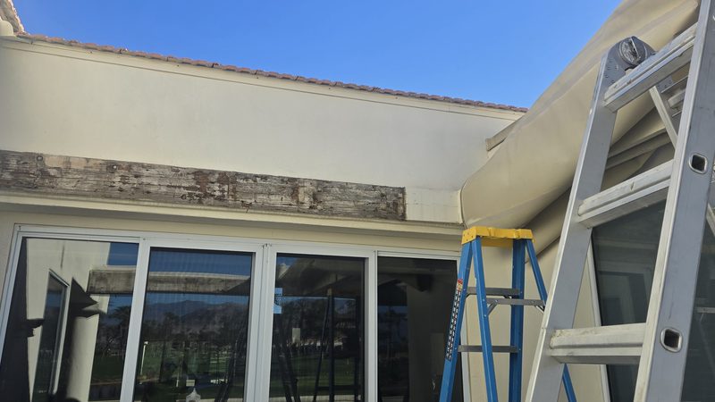 Exposed rotted ledger board patio cover Coachella Valley